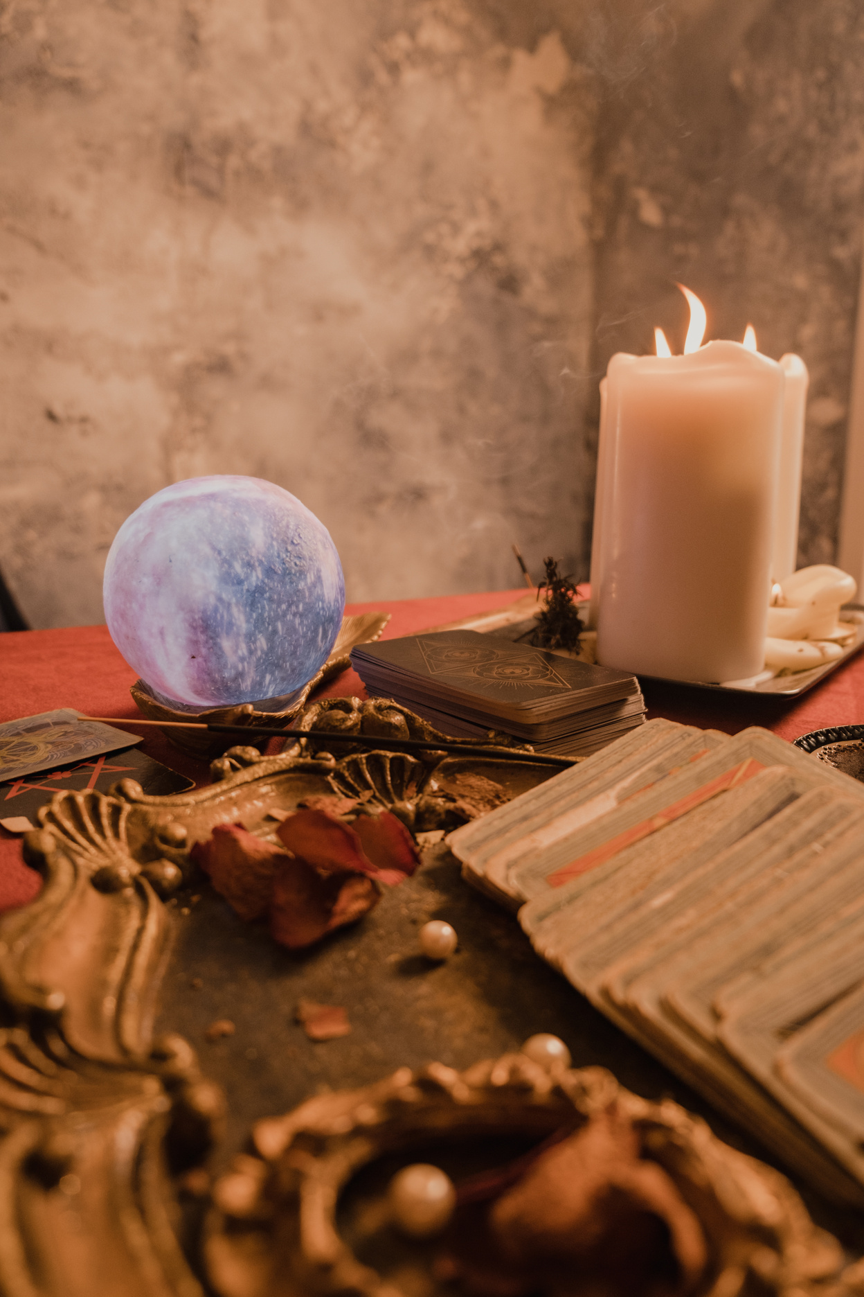 Tarot Cards, Crystal Ball, and Candles on the Table